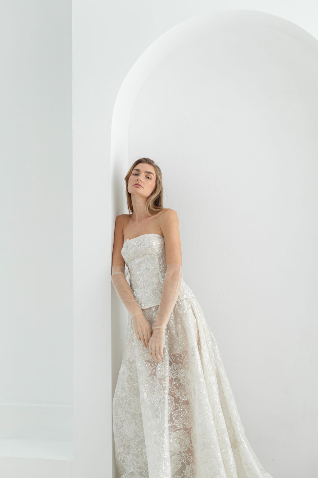 Two piece lace wedding dress with structured corset, dramatic train, and refined A-line silhouette  corset for ceremonial weddings